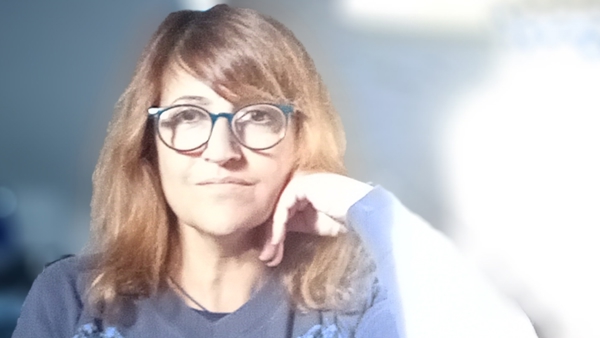 a person with her hand on her chin