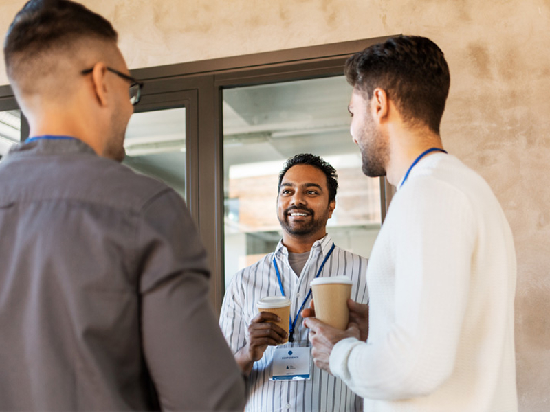 a group of men talking to each other