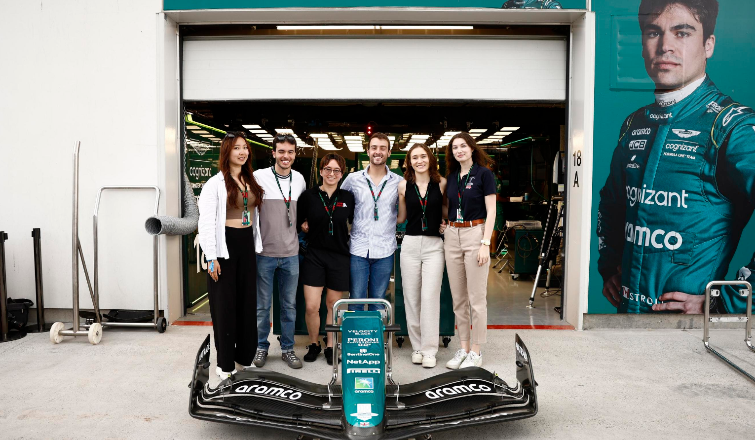 a group of people standing in front of a garage door