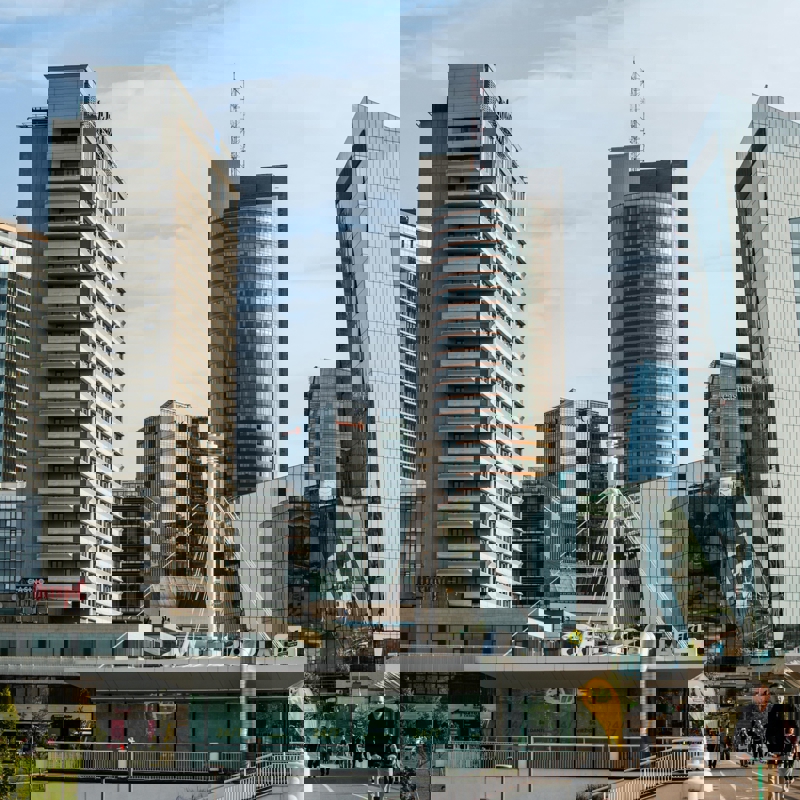 a group of people walking in a city