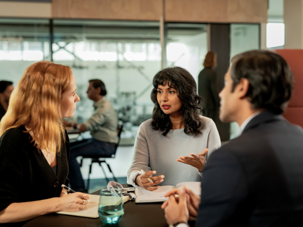 a group of people sitting around a table