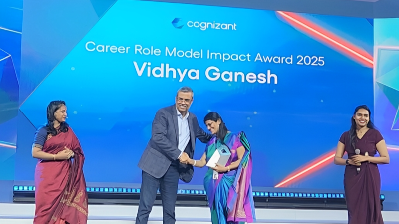 a person shaking hands with a person on a stage