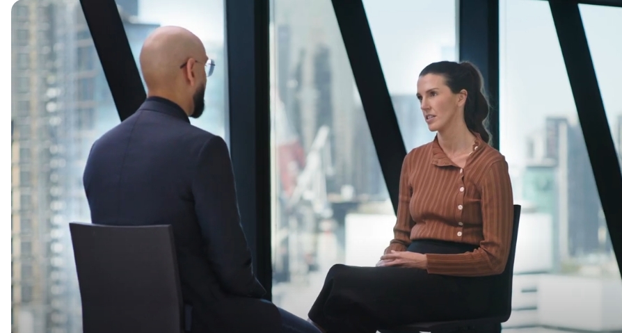 a person and person sitting in a room