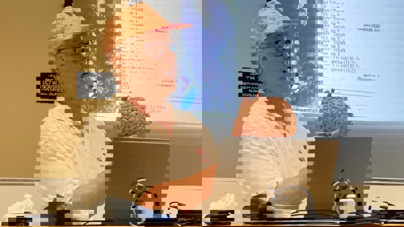 a person holding a brain