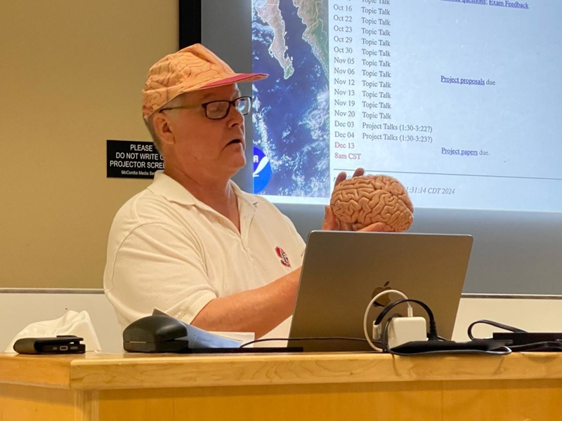 a person holding a brain