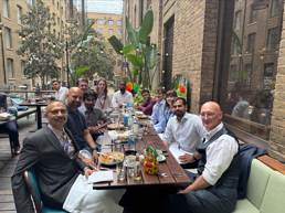 a group of people sitting at a table