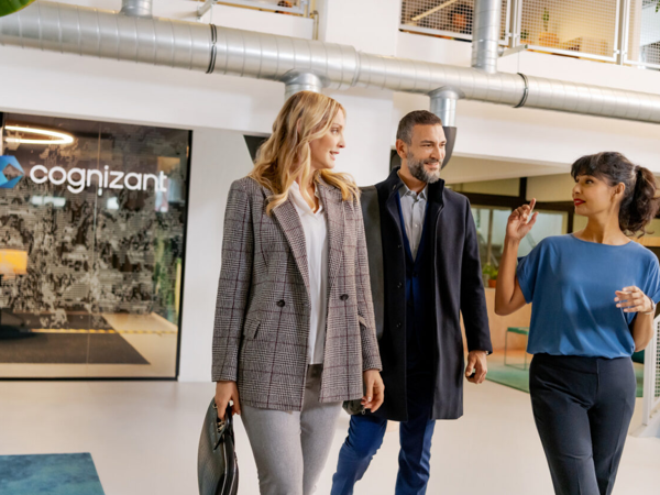 a group of people walking in a building