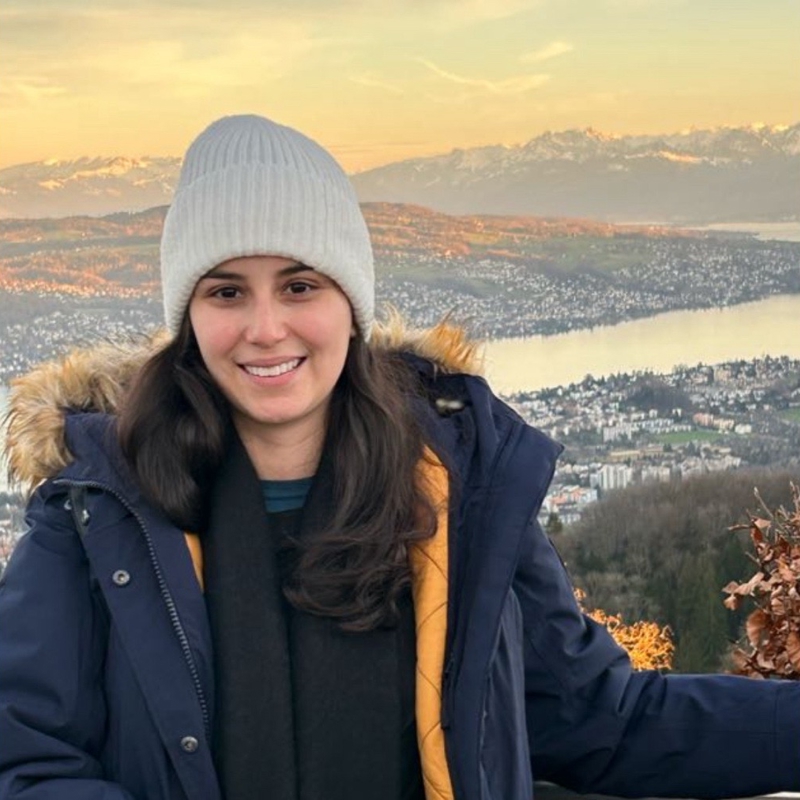 a person in a hat and coat