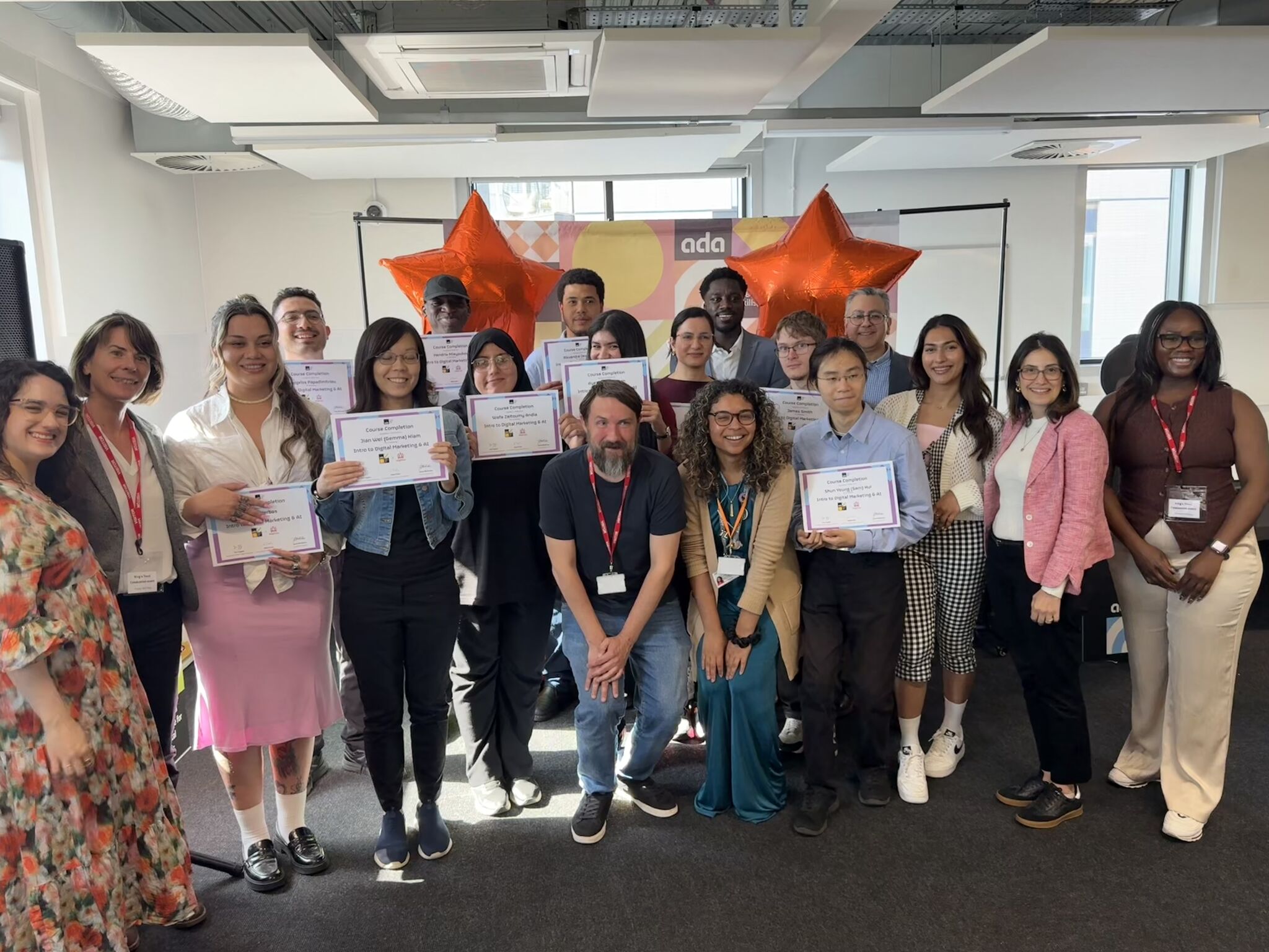a group of people holding certificates
