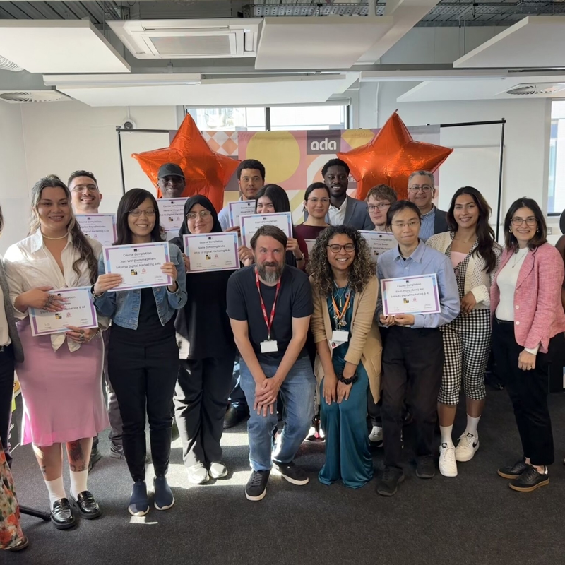 a group of people holding certificates