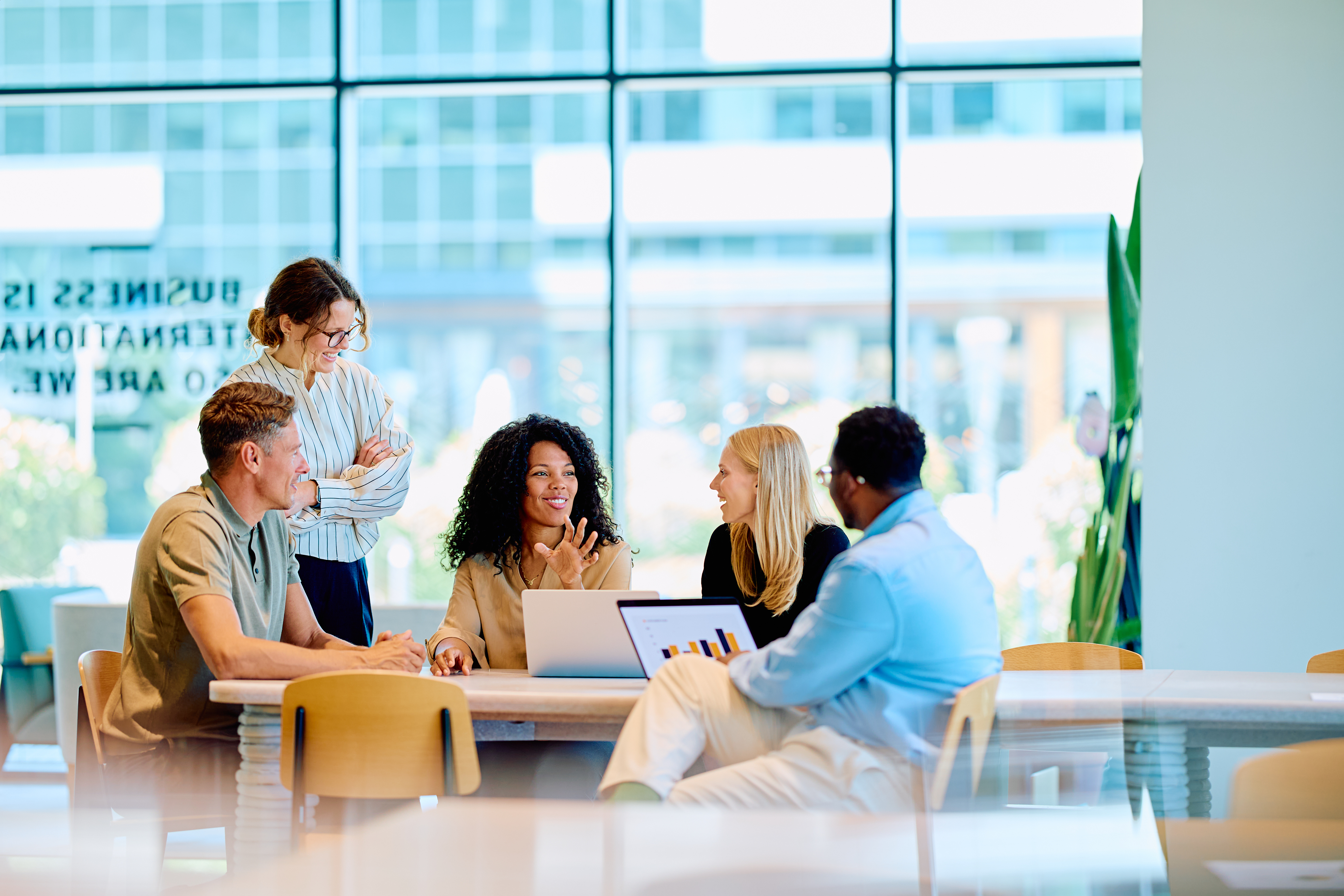 a group of people sitting around a table