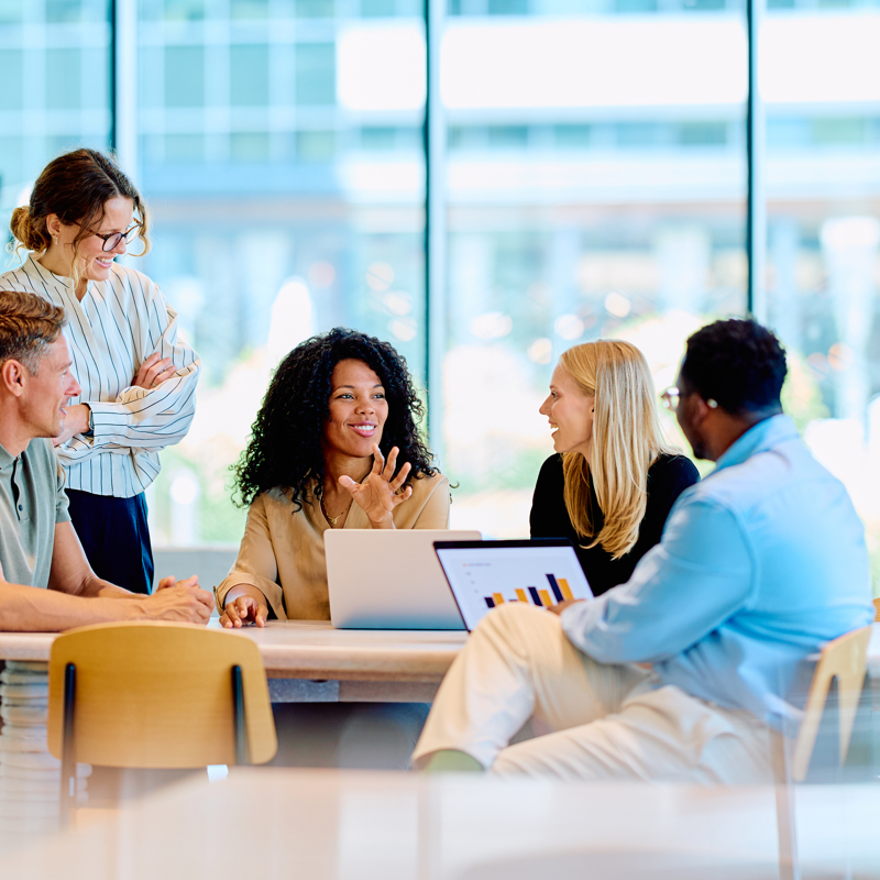 a group of people sitting around a table
