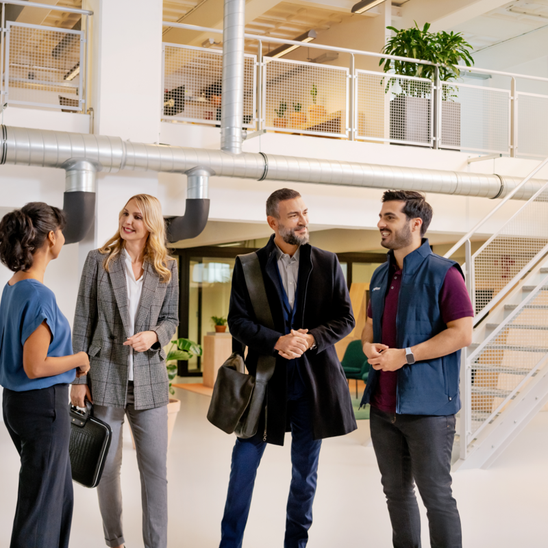 a group of people standing in a room
