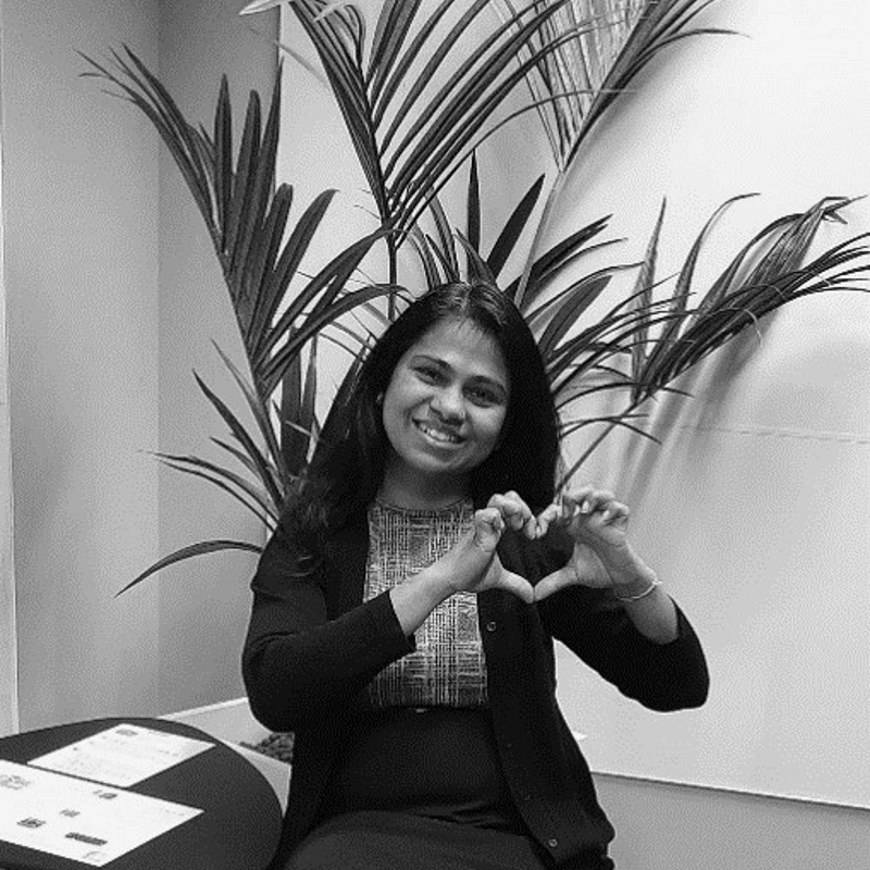 a person making a heart with her hands