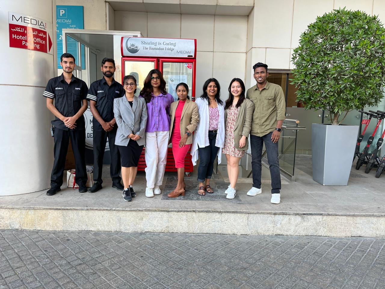 a group of people standing in front of a building