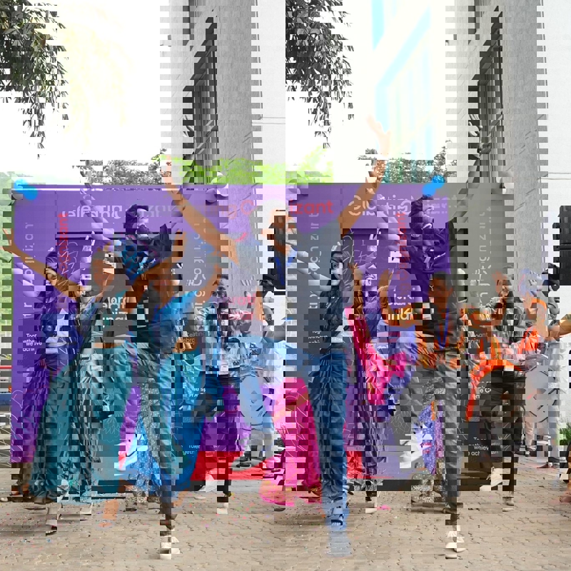 a group of people jumping in the air