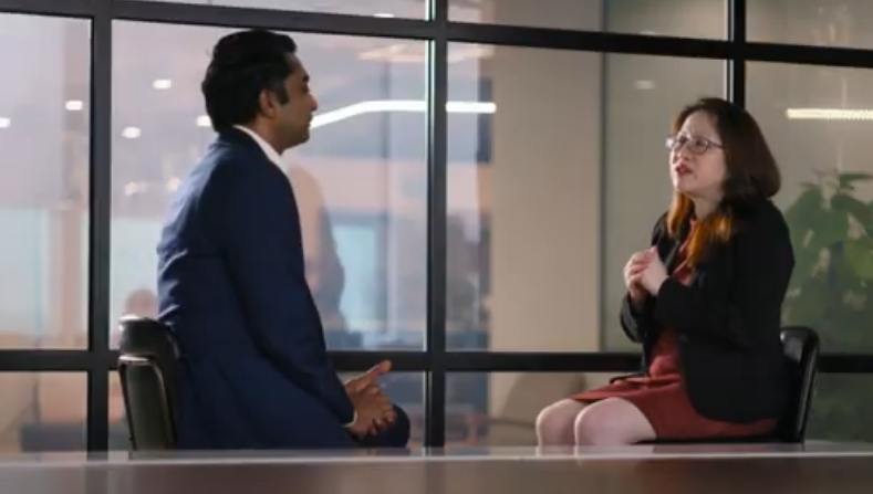 a person and person sitting in front of a window