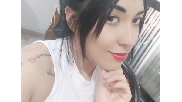 a person with her hand on her chin