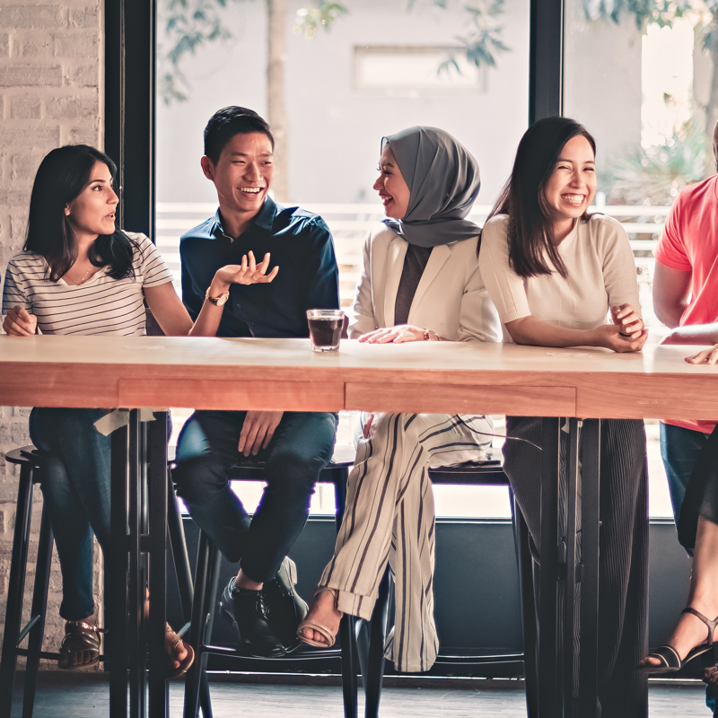 a group of people sitting at a table