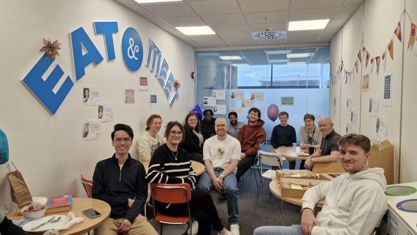 a group of people sitting at tables in a room