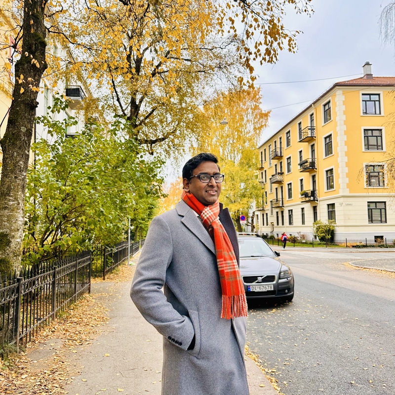 a person standing on a sidewalk