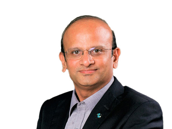 a person wearing a suit and glasses