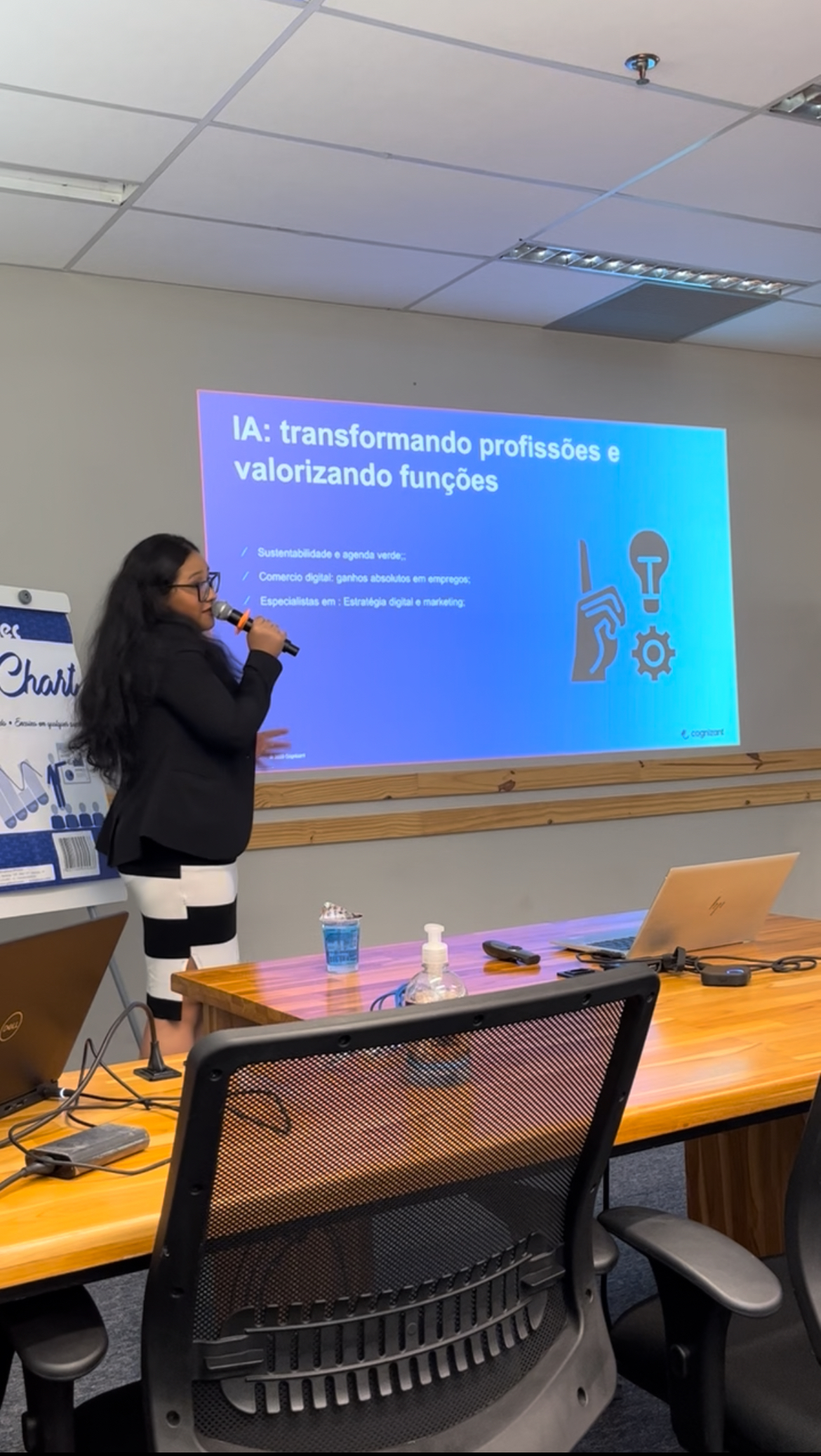 a person standing in front of a projector screen