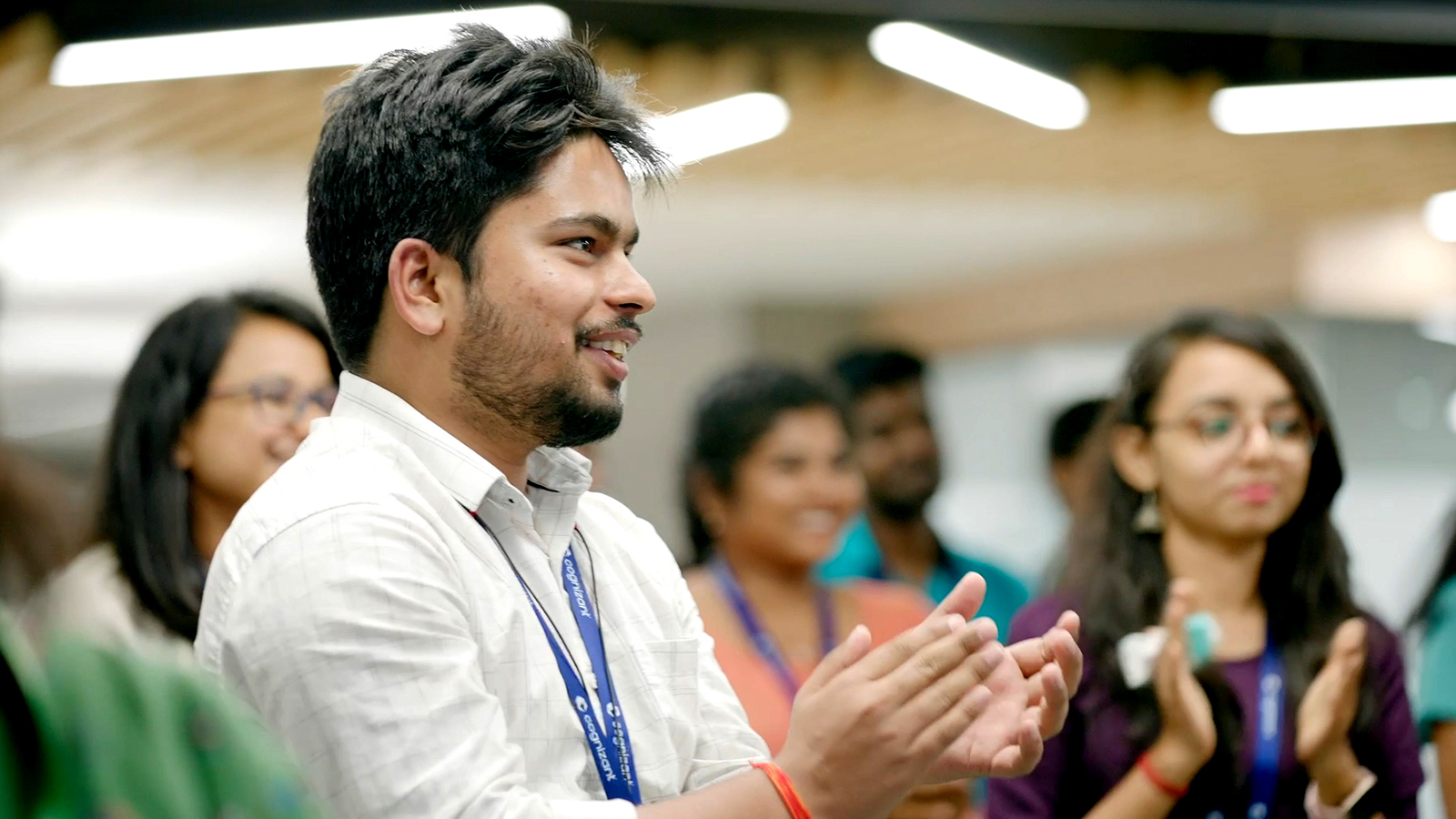 a person clapping in a room