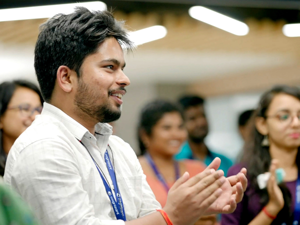 a person clapping in a room