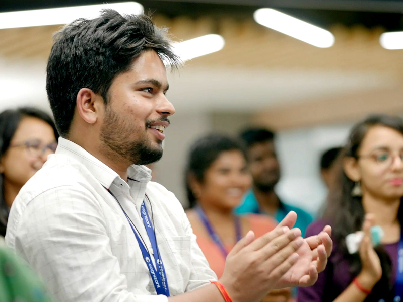 a person clapping in a room