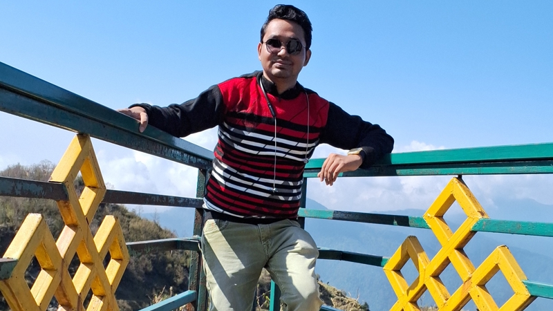 a person posing on a railing