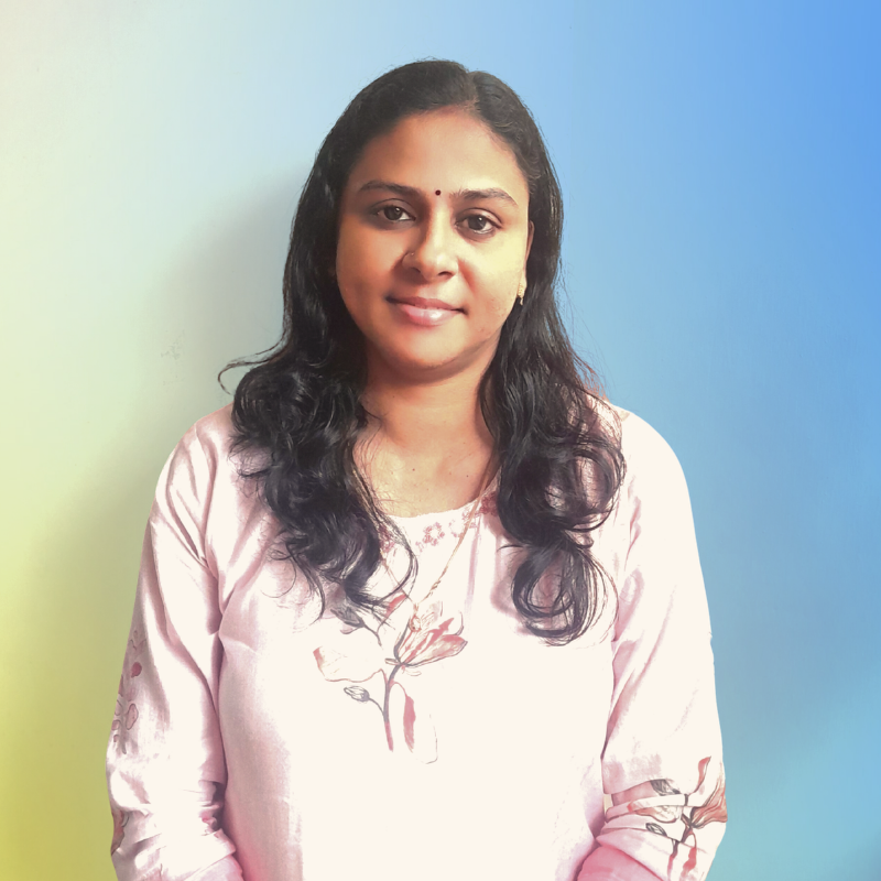 a person with long hair wearing a pink shirt