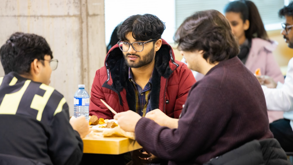 a group of men sitting at a table