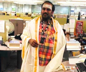 In traditional attire at my workspace