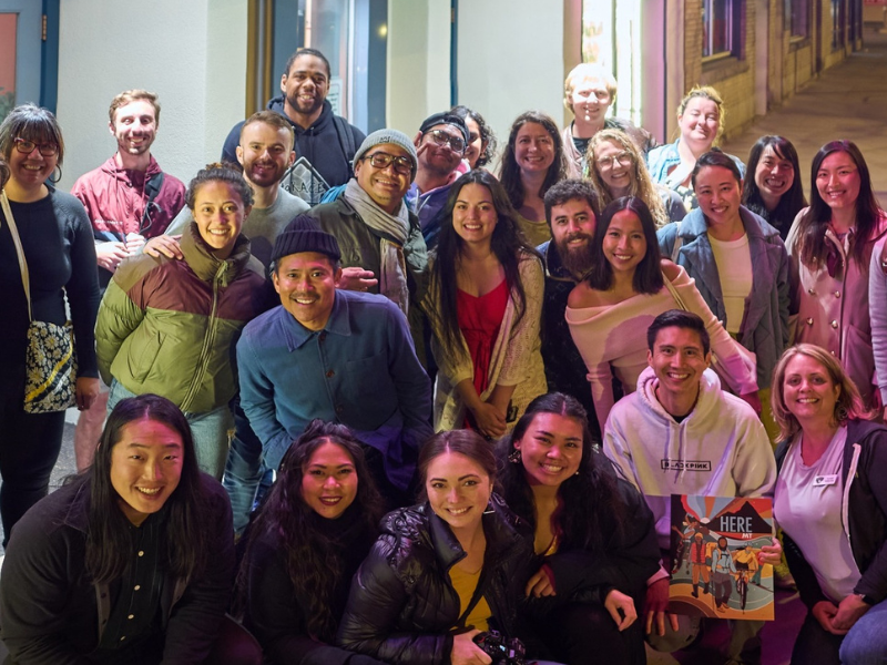 a group of people posing for a photo