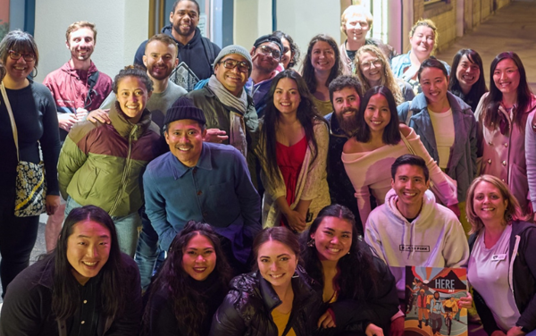 a group of people posing for a photo