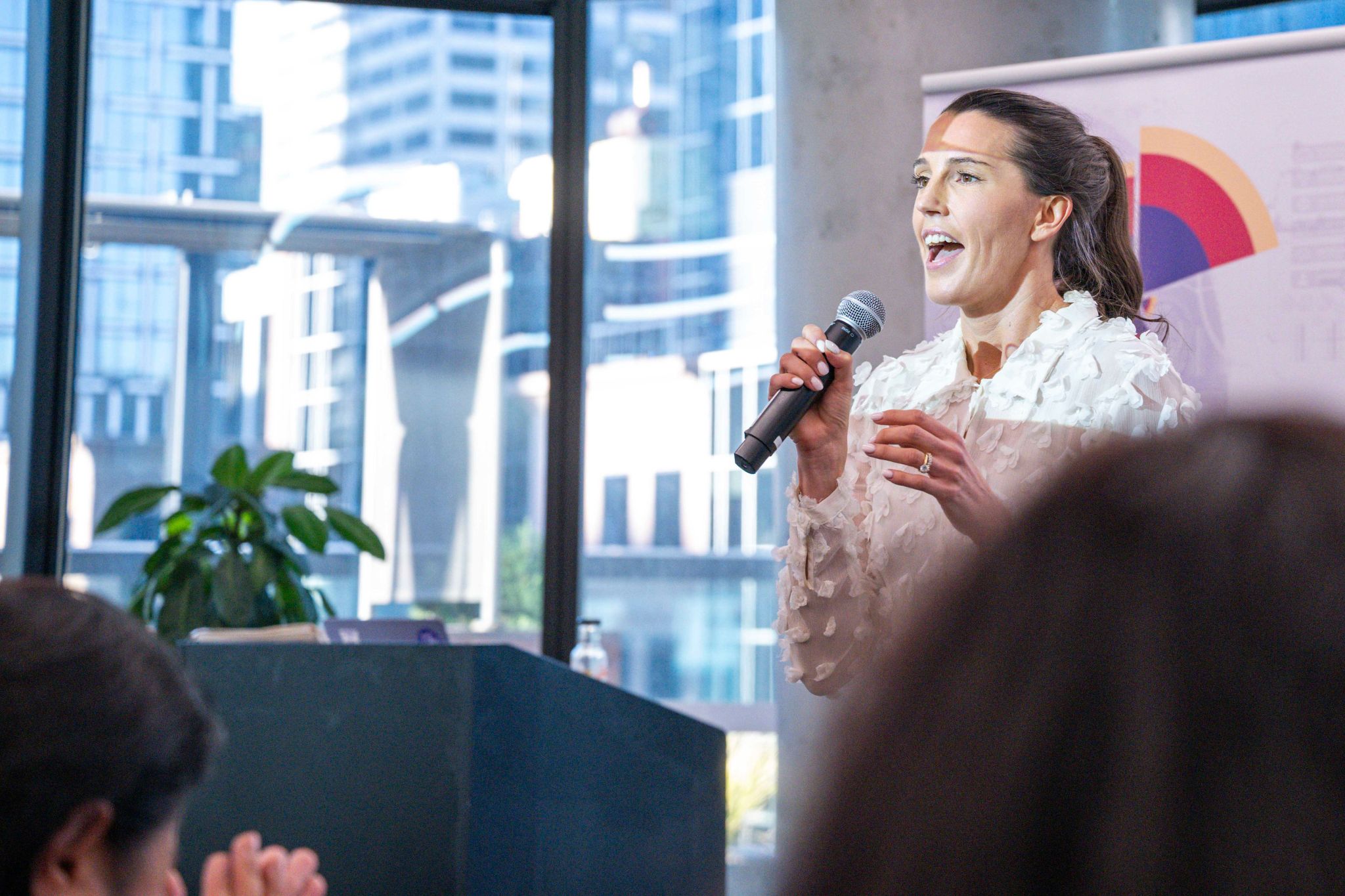 a person speaking into a microphone