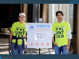 a person and person standing next to a sign