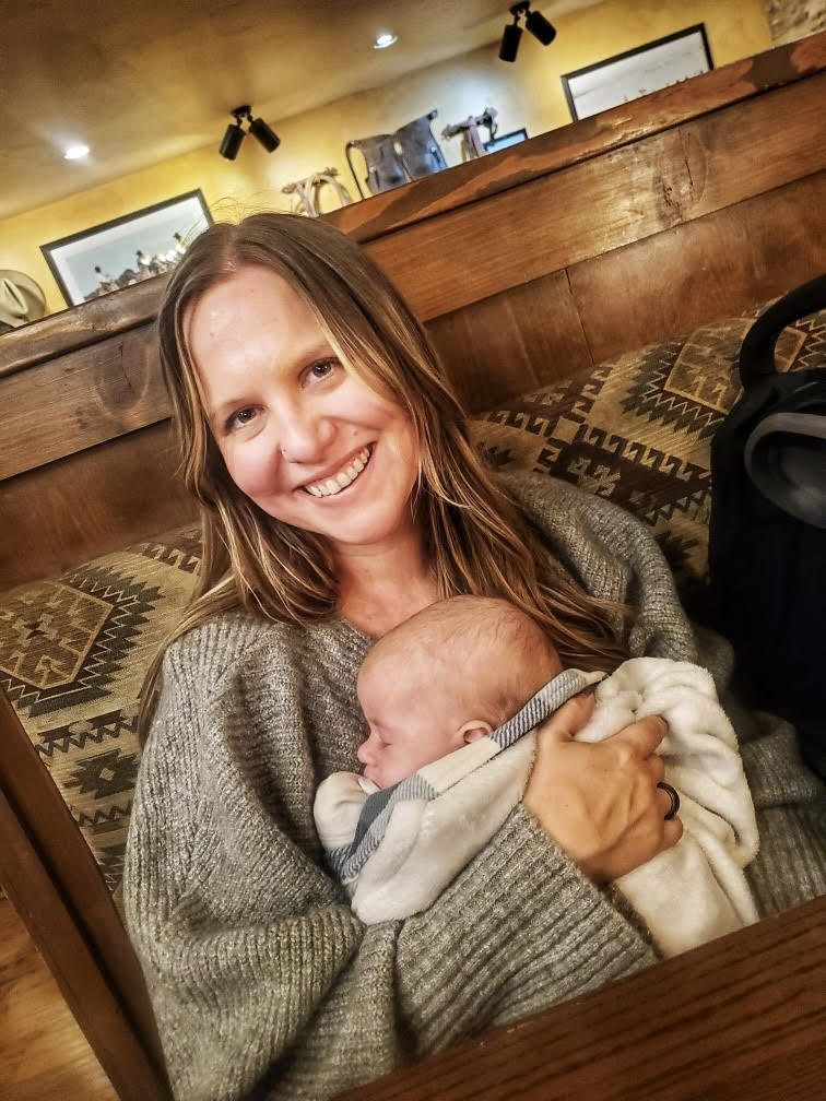 a person holding a baby