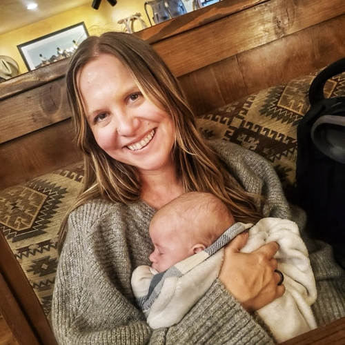 a person holding a baby