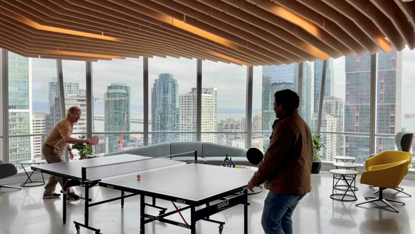a group of men playing ping pong