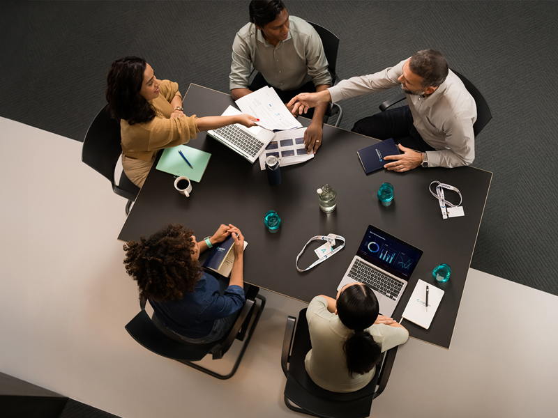 a group of people sitting around a table