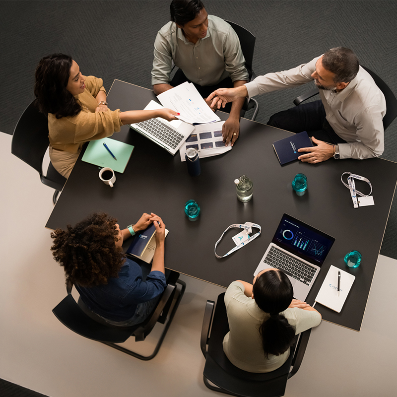 a group of people sitting around a table