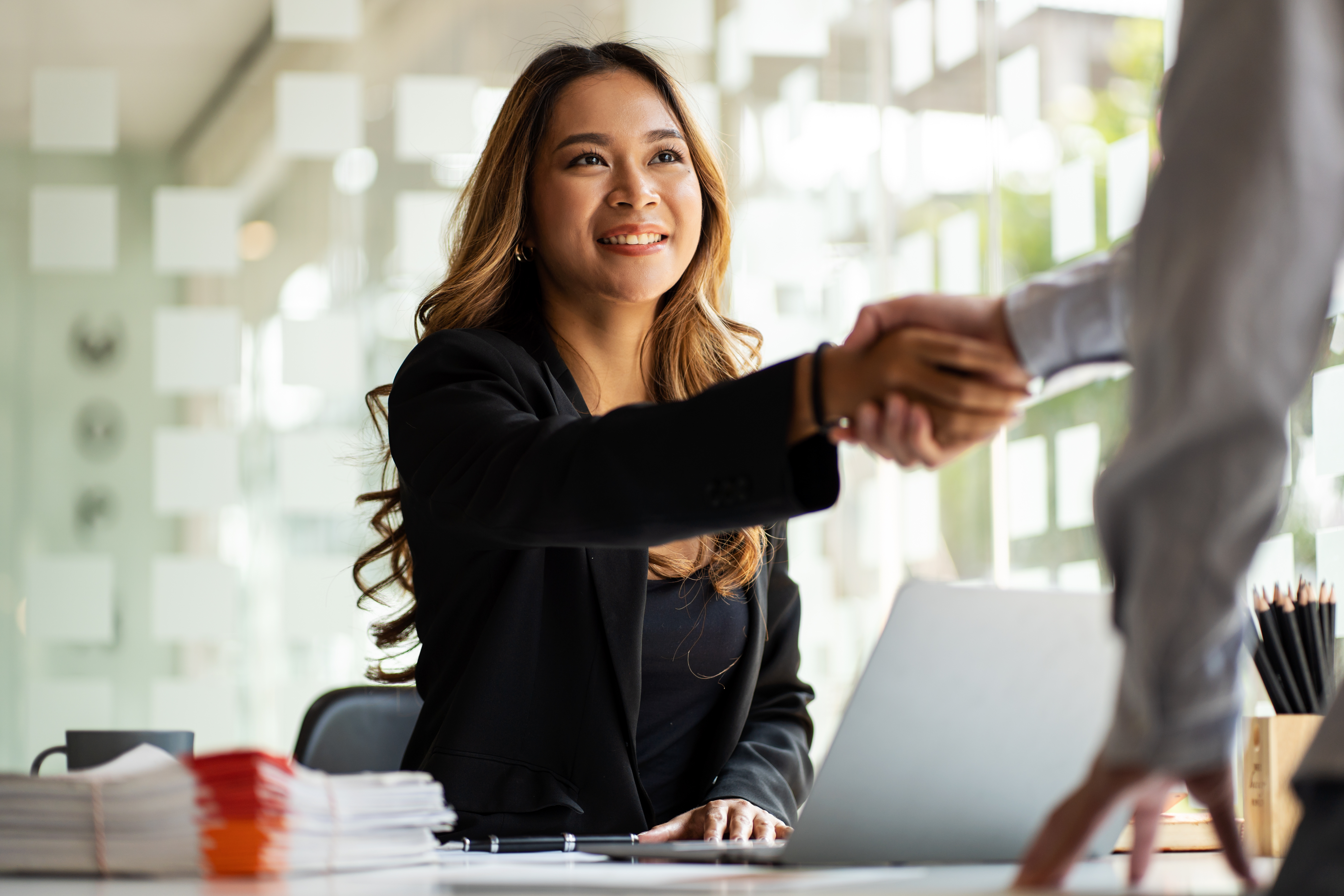 a person shaking hands with a person