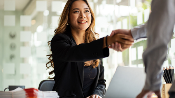 a person shaking hands with a person