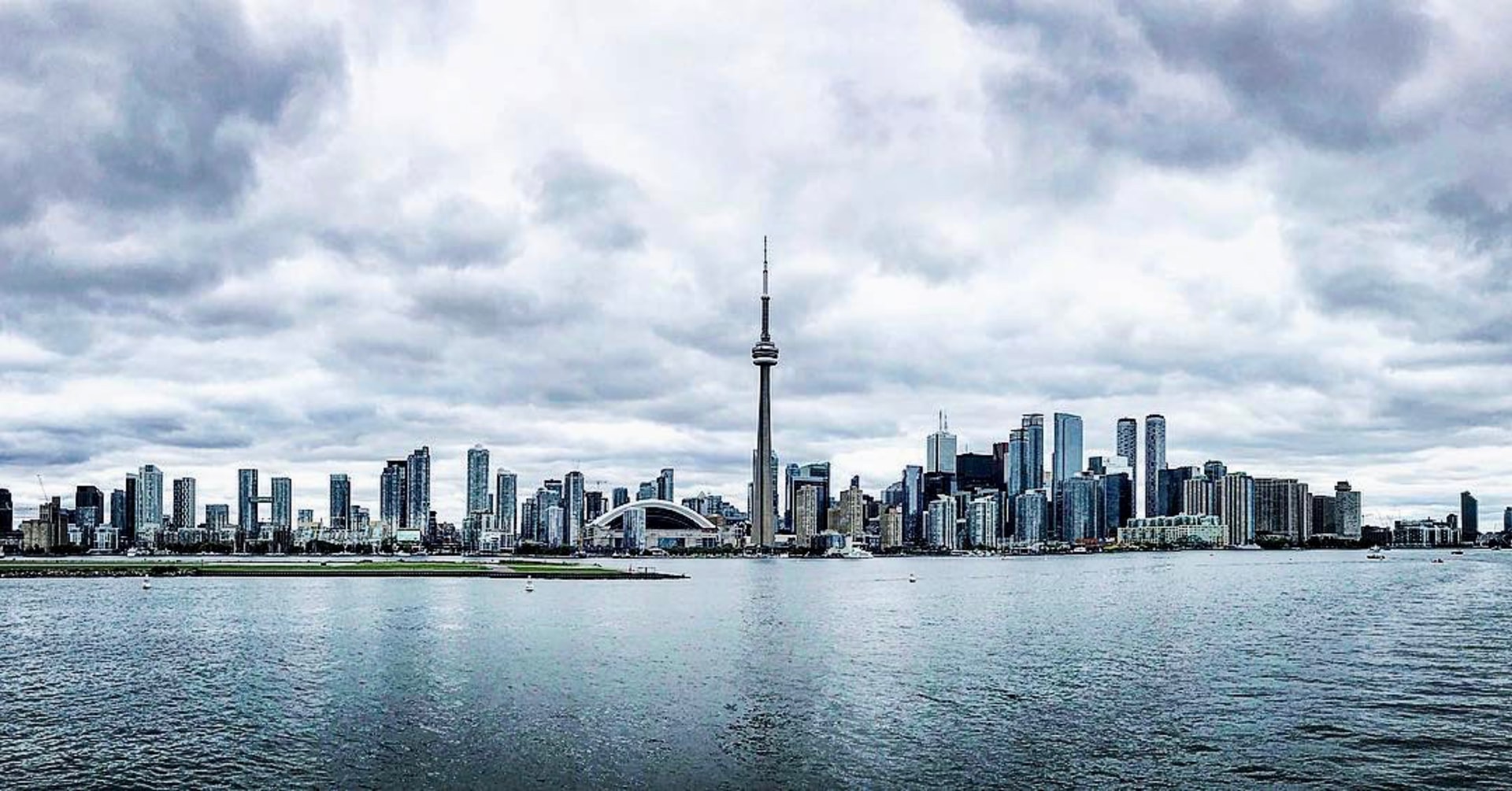 a city skyline with a body of water