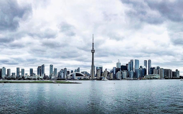 a city skyline with a body of water