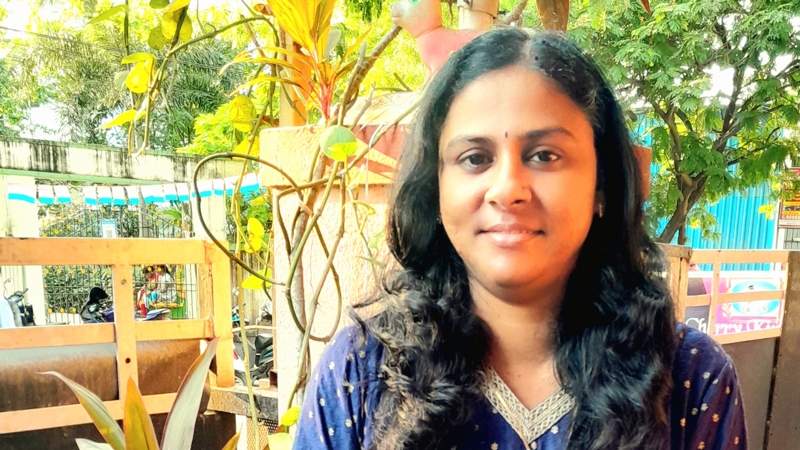 a person standing outside smiling