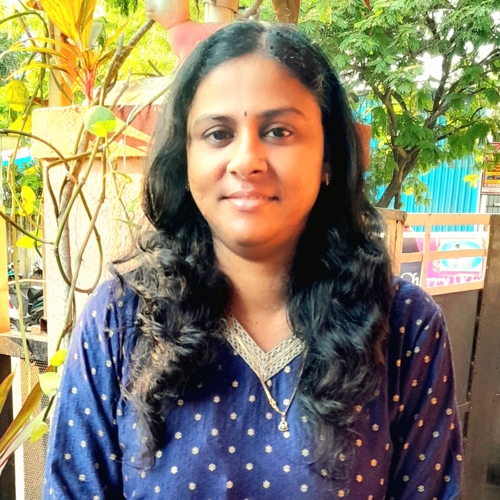 a person standing outside smiling