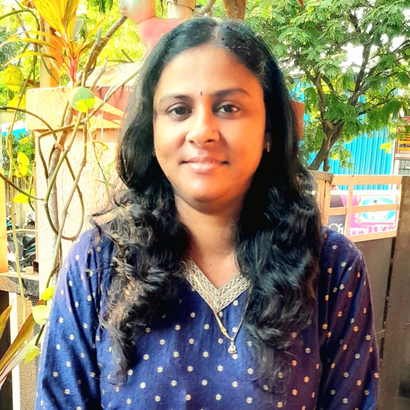 a person standing outside smiling